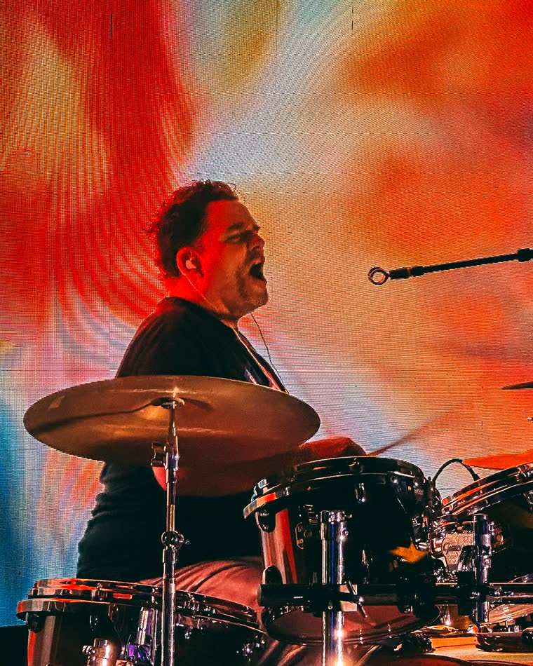Mario playing drums on stage